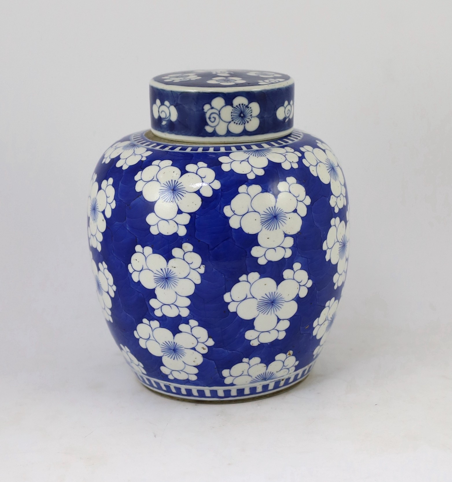 A Chinese blue and white prunus jar and cover, 19th century, 25cm high, cover associated